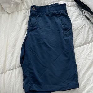 Navy blue men’s golf shorts from under Armour